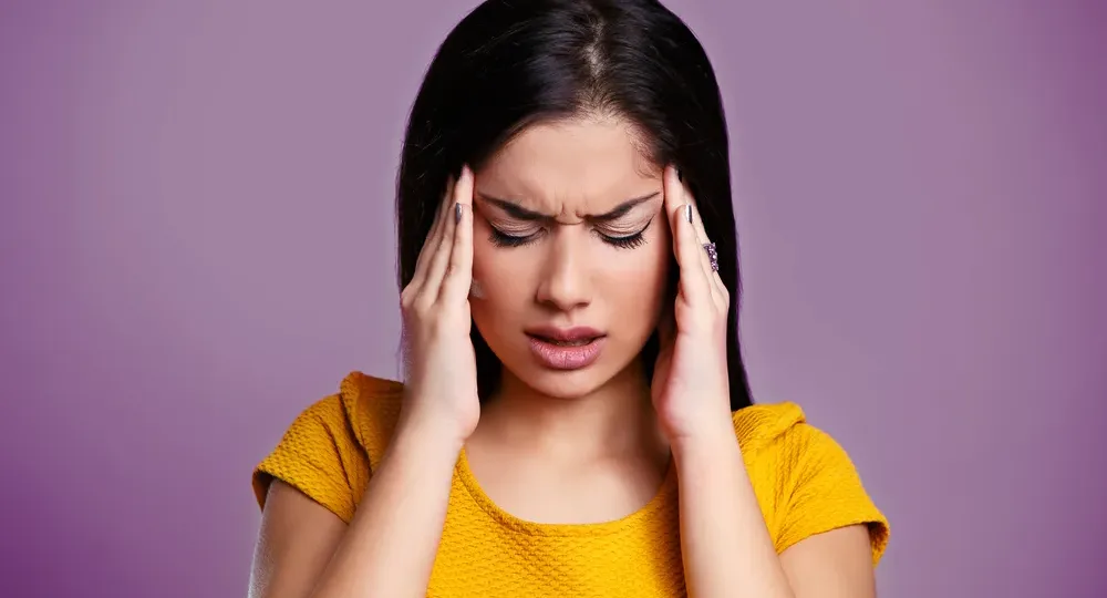The Relationship & Differences Between TMJ and Migraines